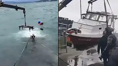 Lodos nedeniyle batanbalıkçı teknesi vinç yardımıyla çıkarıldı