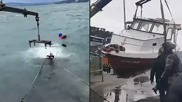 Lodos nedeniyle batanbalıkçı teknesi vinç yardımıyla çıkarıldı